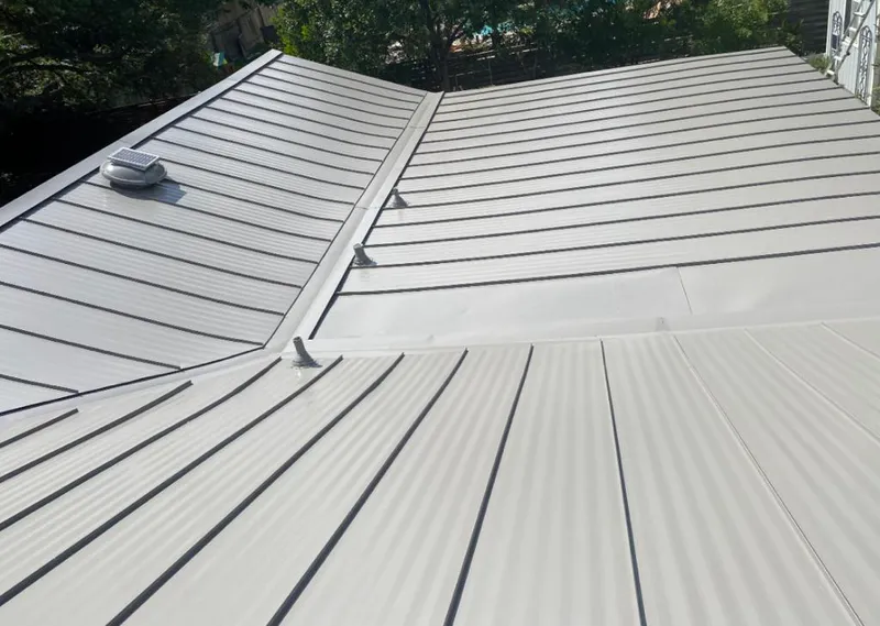 Solar attic fan installed on a metal roof for Roof Ventilation in Libertyville